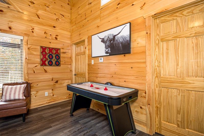 Air hockey table in your cabin rental's game room. at Big Splash Lodge in Gatlinburg TN