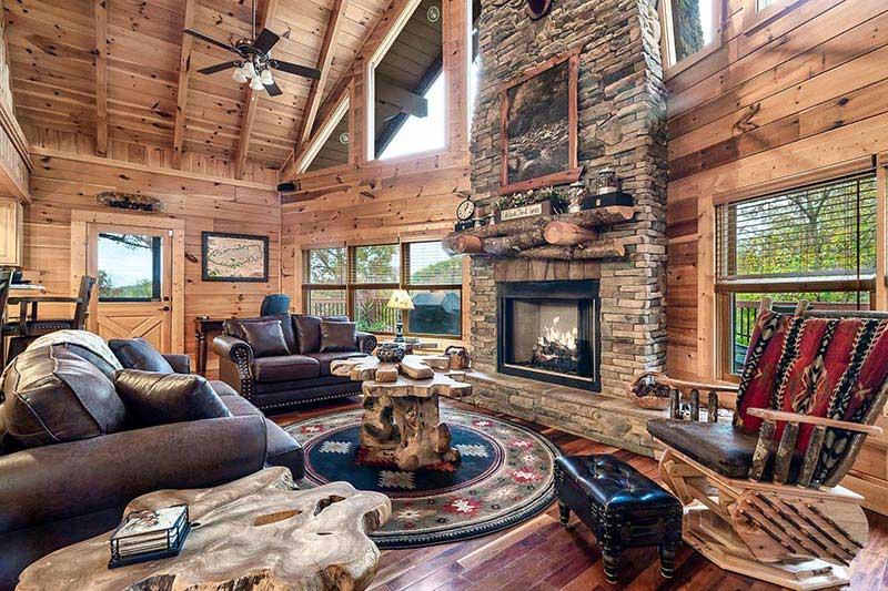 The rustic charm of a stacked stone fireplace. at Alpine Oasis in Gatlinburg TN