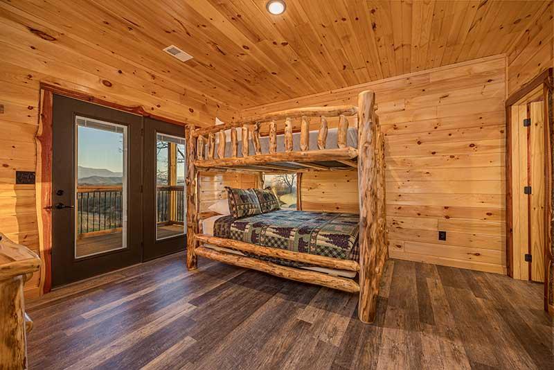 Bunk up in the 3rd bedroom with these comfortable log bunks. at Morning View in Gatlinburg TN