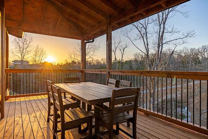 East outdoors at your cabin's porch covered table. at Morning View in Gatlinburg TN