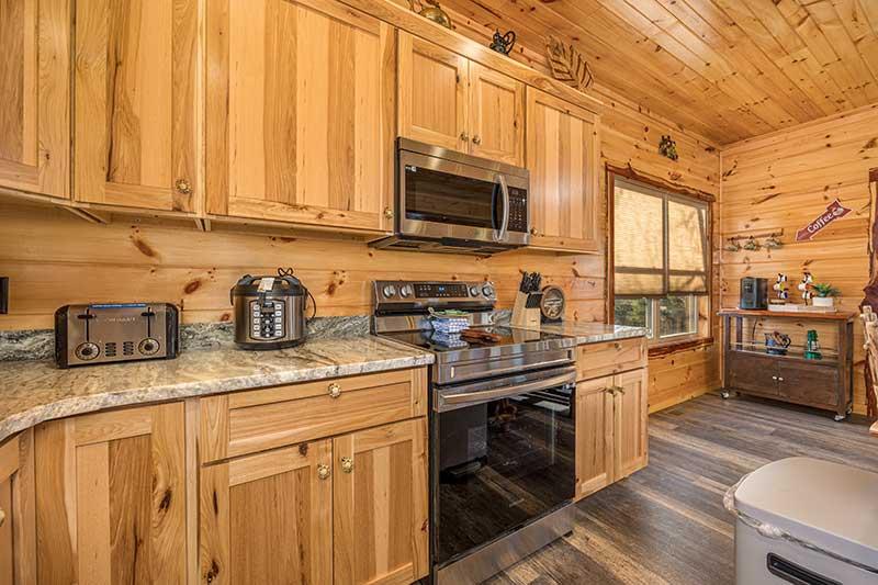 Your cabin kitchen with the amenities of home. at Sunset Peak in Gatlinburg TN