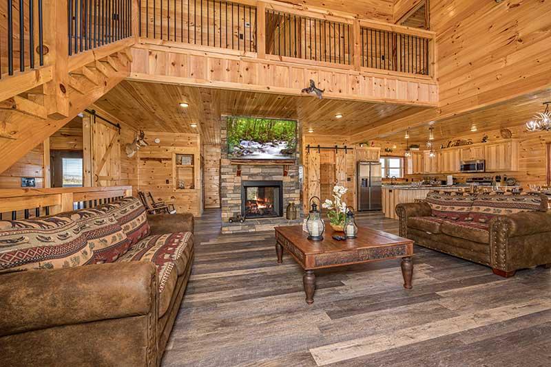 Balcony view and fireplace from the cabin's Livingroom. at Sunset Peak in Gatlinburg TN