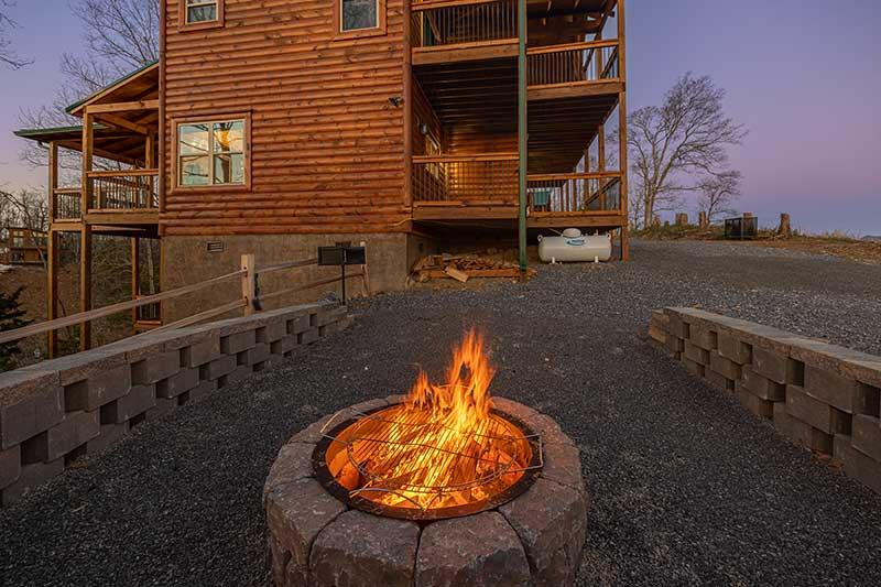 Gather round the cabin fire pit for a weenie roast. at Sunset Peak in Gatlinburg TN