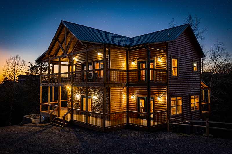 Smoky Mountains cabin as nighttime approaches. at Sunset Peak in Gatlinburg TN