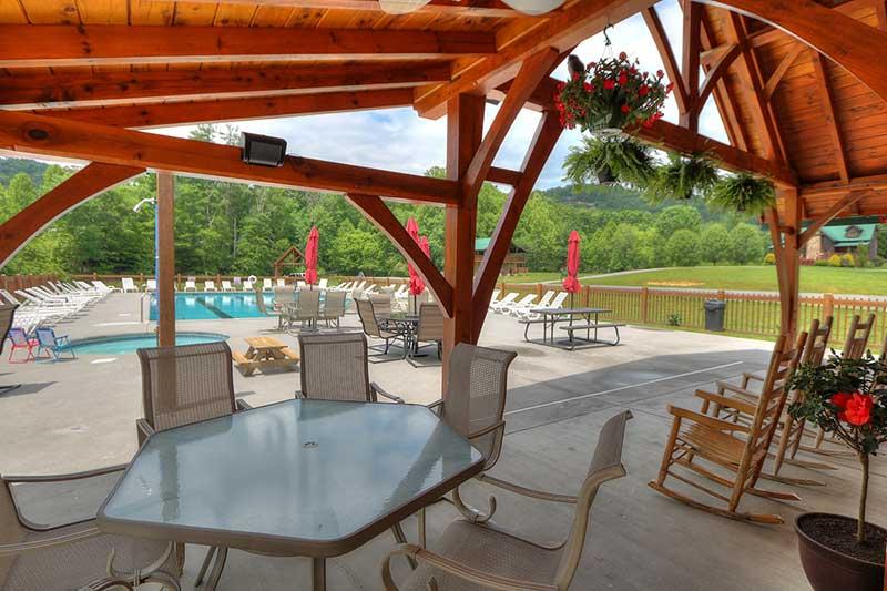 Poolside seating at Wears Valley Honey Suckle Meadows RV Park. at Alpine Oasis in Gatlinburg TN