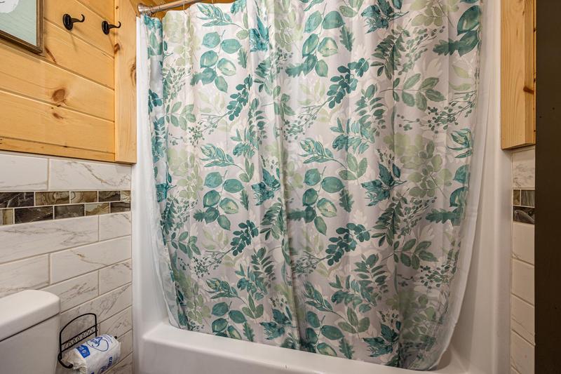 Cabin's bath and shower combo. at Mountain Creek View in Gatlinburg TN