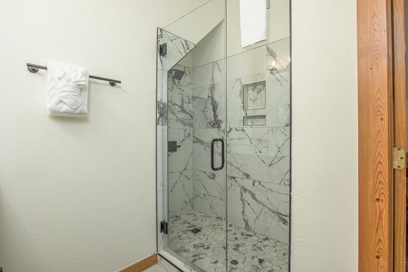 Step into this marvelous marbled glass shower. at Five Bears Mountain View Lodge in Gatlinburg TN