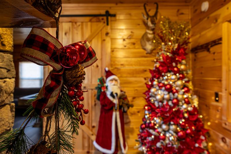 Holy and ribbons set off your cabin's fireplace. at Sunset Peak in Gatlinburg TN