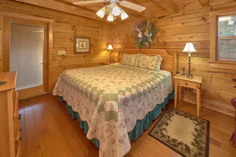 Your cabin's first bedroom with king bed. at Wrap Around The Son in Gatlinburg TN