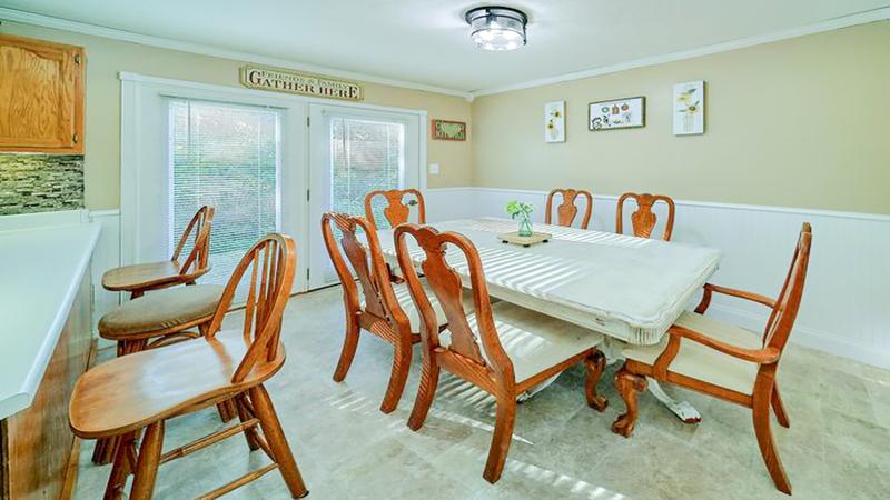 Dining table and breakfast bar at your vacation rental home. at Bear Splashin Fun in Gatlinburg TN