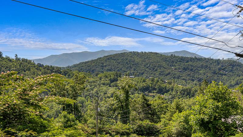 View from the long porch of your 5 bedroom cabin in the Tennessee Smoky Mountains. at Bear Crossing in Gatlinburg TN