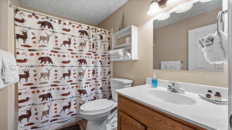 First of 3 baths with tub and shower combo. at Bear Crossing in Gatlinburg TN