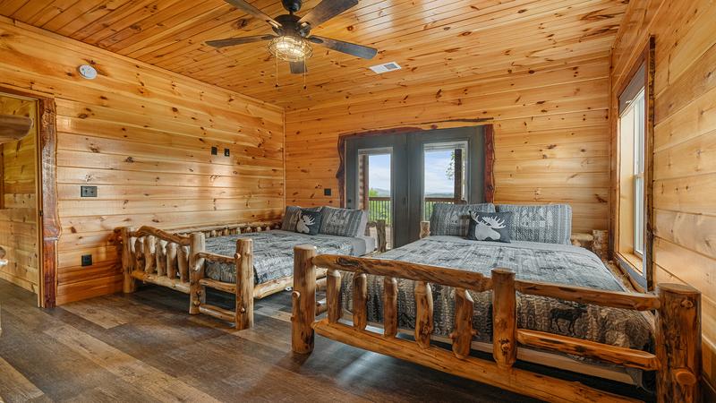 Log queen beds in the 3rd bedroom.