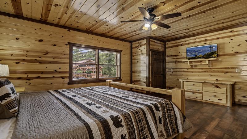 Spacious 2nd bedroom with its personal television.