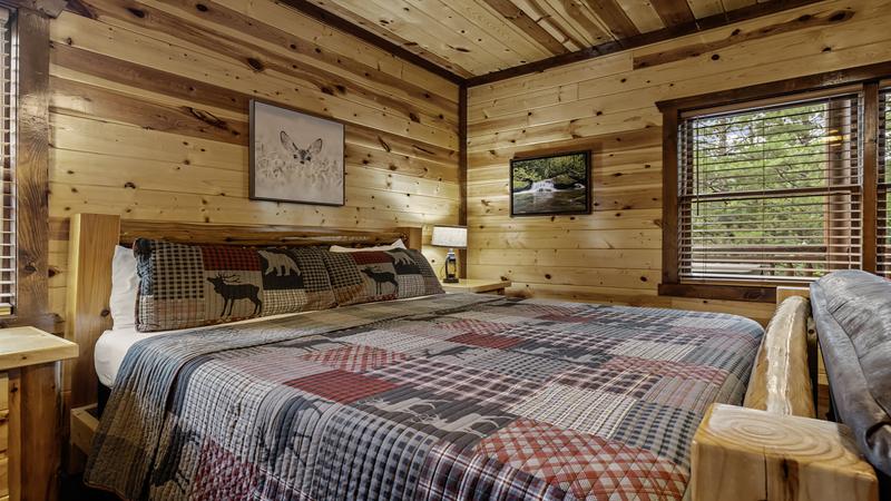 King sized log bed in your cabin's 4th bedroom.