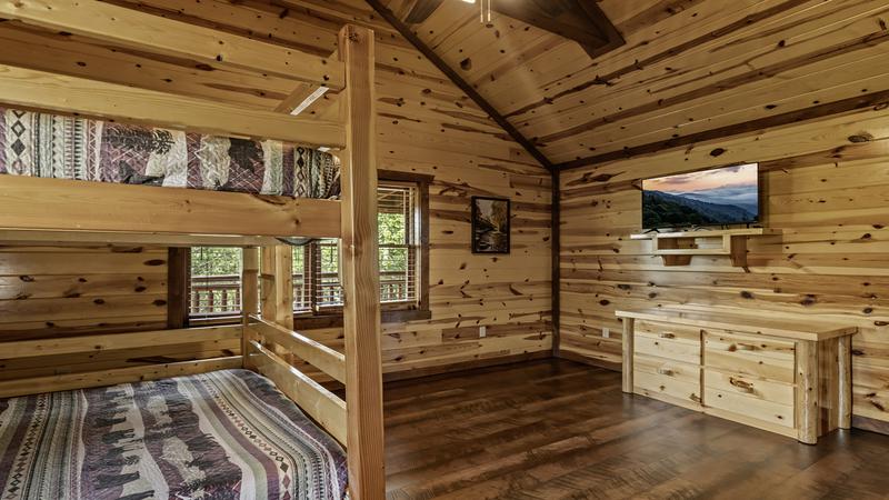 Flat screen television in your queen bed bunk room.