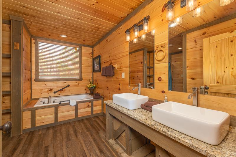 Second bedroom's bath with his and hers farm basins.  at The Appalachian in Gatlinburg TN