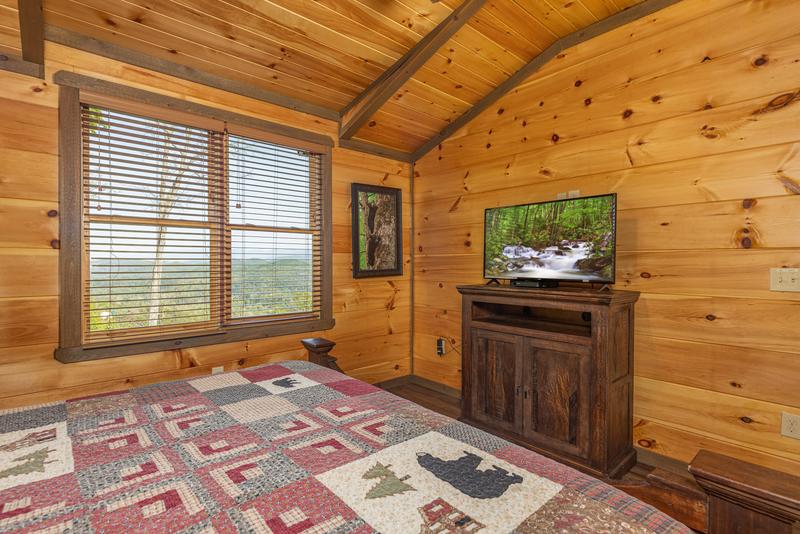 Televisions in each of the cabin's bedrooms provides late night entertainment.  at The Appalachian in Gatlinburg TN