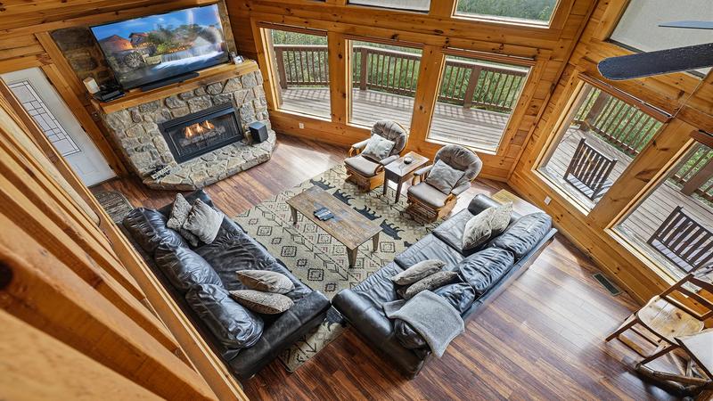 Down View Spacious Living Area Looking down from the loft into the spacious living area with stone fireplace.