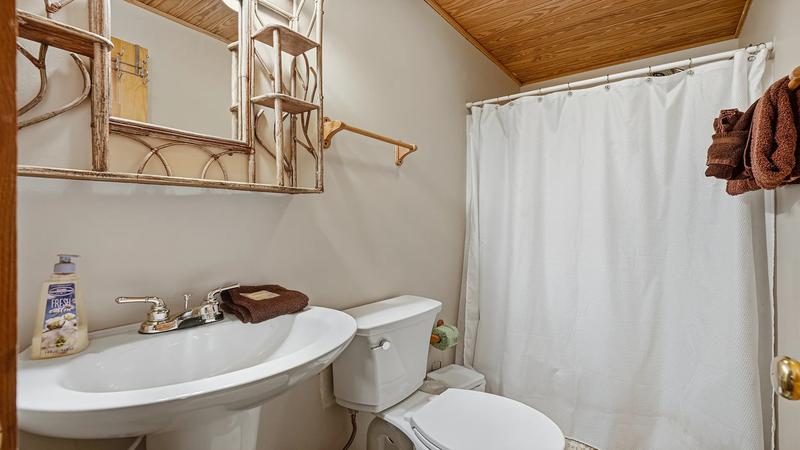 Full Cabin Rental Bath Full bath in cabin rental's first bedroom.