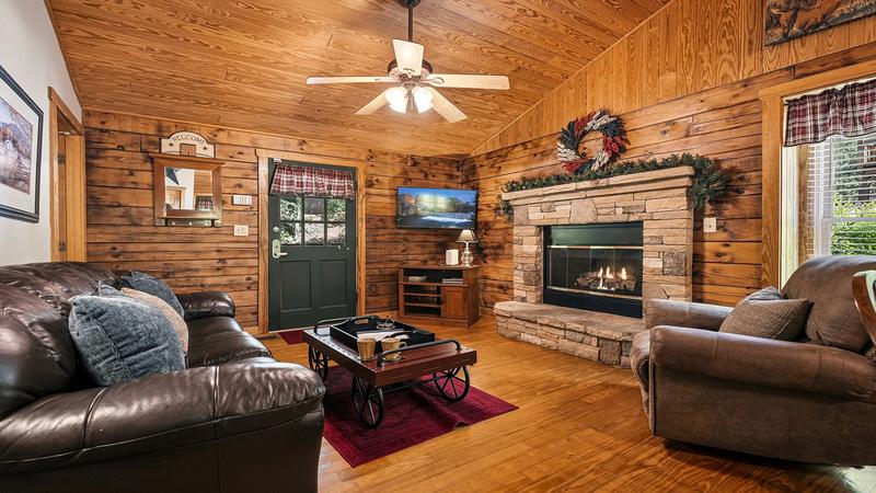 Cabin Rental Living Room Cabin rental living room with stacked stone fireplace.
