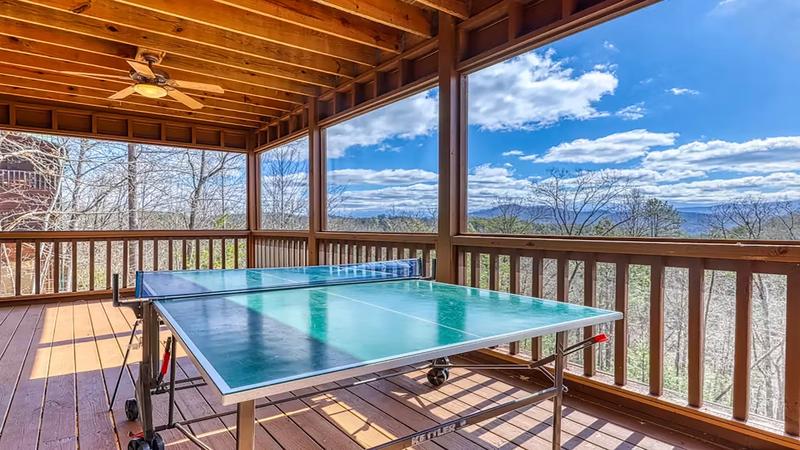 Beautiful Smokey Mountain Views Cabin Porch Take in unforgettable mountain views from the spacious back deck.