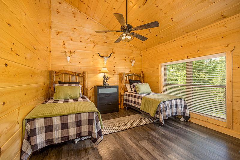 Twin beds in your cabin's bedroom upstairs. at Big Splash Lodge in Gatlinburg TN