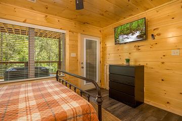 Each of the 3 bedrooms have a flat screen tv. at Big Splash Lodge in Gatlinburg TN