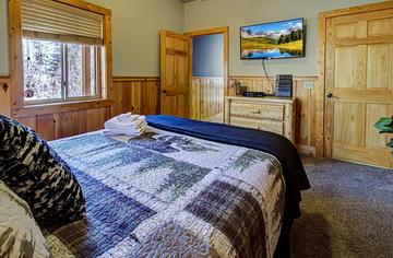 Bedroom 2 with television and private bath. at A Great Escape in Gatlinburg TN