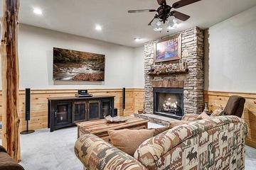 Enjoy family time watching tv with the glow of the fireplace. at Alpine Oasis in Gatlinburg TN