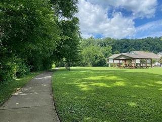 Enjoy somber moments together walking along the paved trail by the Little Pigeon River. at River Waltz in Gatlinburg TN