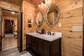 Double sinks in your cabin's 1st bedroom. at Moonlight Obsession in Gatlinburg TN