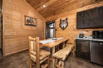 Cabin log dining table for 5 people. at Moonlight Obsession in Gatlinburg TN