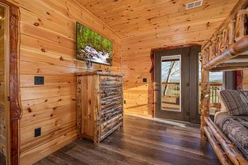 Catch up on some tv or walk out onto the porch to view sunsets. at Sunset Peak in Gatlinburg TN