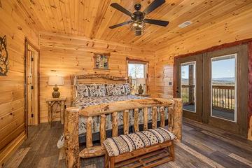 Smokies cabin's second bedroom with log bed. at Sunset Peak in Gatlinburg TN