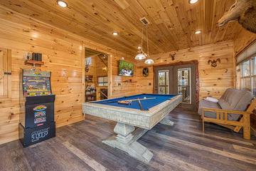 Weather won't dampen your fun at this big cabin's game room. at Sunset Peak in Gatlinburg TN