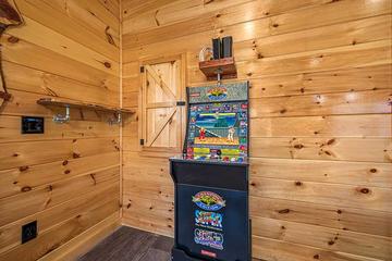 Spend fun times on the game room's multi-game arcade. at Sunset Peak in Gatlinburg TN