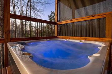 Your cabin offers a soft lighted romantic hot tub. at Sunset Peak in Gatlinburg TN