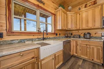 Cabin kitchen with Farmers sink.  at Sunset Peak in Gatlinburg TN