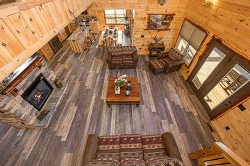 View of the living room from the cabin stairs. at Sunset Peak in Gatlinburg TN