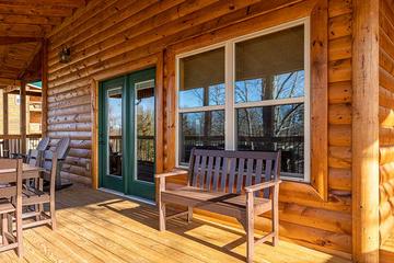 Cabin porch bench seating. at Sunset Peak in Gatlinburg TN