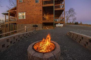 Gather round the cabin fire pit for a weenie roast. at Sunset Peak in Gatlinburg TN