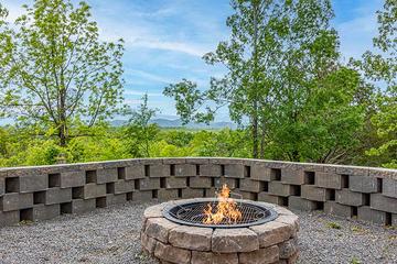 Daytime roasting fun around the fire pit. at Sunset Peak in Gatlinburg TN