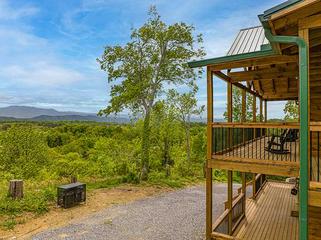 Side porch views of the Smoky Mountains. at Sunset Peak in Gatlinburg TN