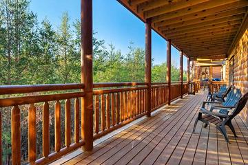 There's plenty of outdoor seating on the many cabin porches.  at Cabin Fever Vacation in Gatlinburg TN