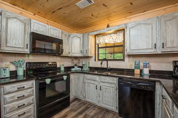 Fully equipped cabin kitchen.  at Mountain Creek View in Gatlinburg TN