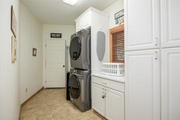 Stacked washer and dryer to handle your laundry needs, so pack lightly. at Five Bears Mountain View Lodge in Gatlinburg TN