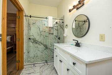 Let it rain warm water in this lovely marbled shower with rain faucet. at Five Bears Mountain View Lodge in Gatlinburg TN