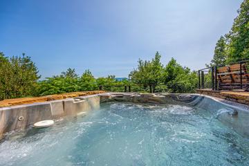 The family will enjoy all the space this cabin's hot tub offers. at Five Bears Mountain View Lodge in Gatlinburg TN