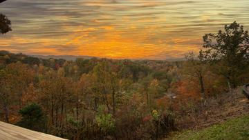 Smoky Mountains sunset as seen from the porch of Moojnlight Obsession cabin rental. at Moonlight Obsession in Gatlinburg TN